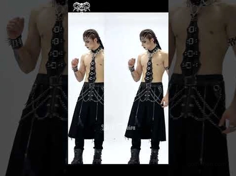 Multiple male goth models wearing gothic chokers as part of full alternative fashion ensembles with chains