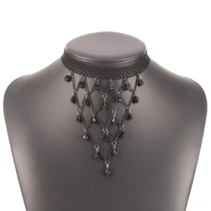 Black lace choker necklace displayed on gray mannequin neck, front close-up view showing dangling lattice bead decorations and adjustable extension chain