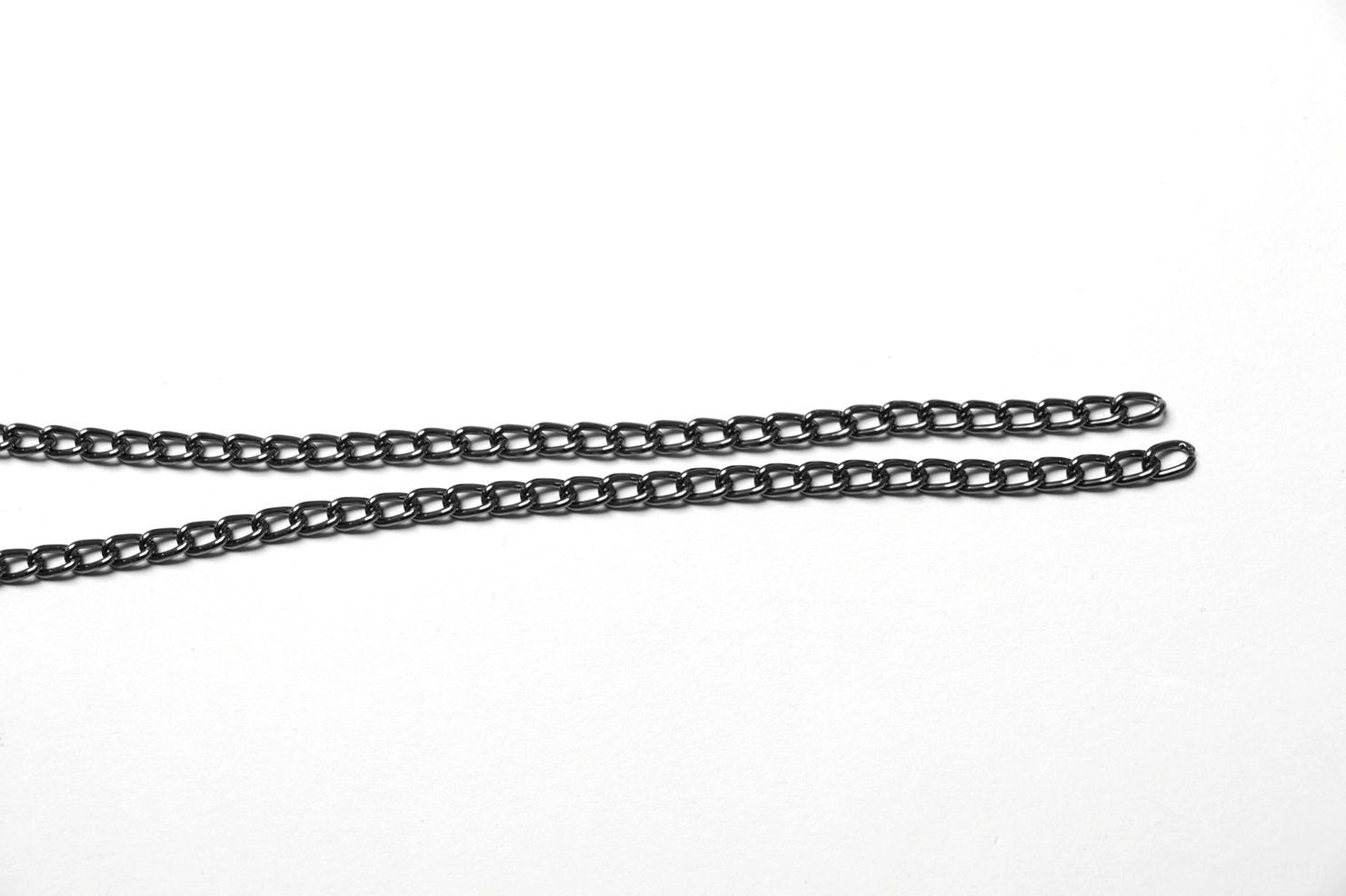 Pair of dark silver chain extenders showing parallel curb chain strands for adjustable gothic choker sizing