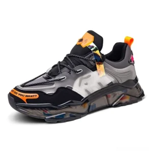 Black with gray chunky sneaker front three-quarter angle showing color contrast and orange slogan detail on toe
