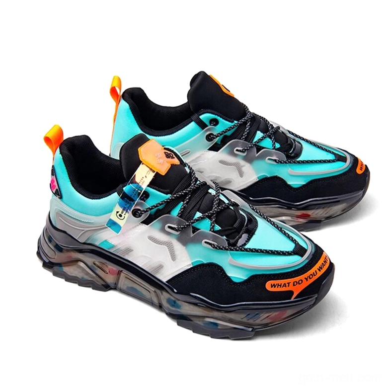 Cyan and black gothic chunky sneaker front three-quarter view with orange heel tab and industrial aesthetic