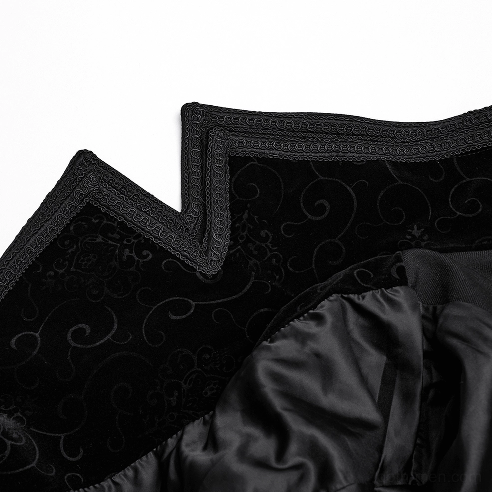 Close-up detail of gothic cloak interior showing swirl embossed velvet, braided satin lining edges and embroidered accents