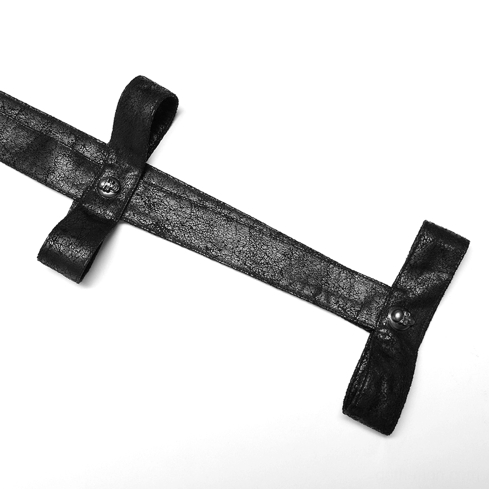 Close-up detail of black cracked rubber arm strap accessory with metal buckle fasteners for gothic longline coat