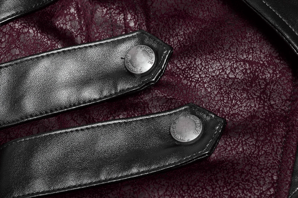 Close-up of burgundy gothic trench coat cuff with black leather straps and metal snap buttons