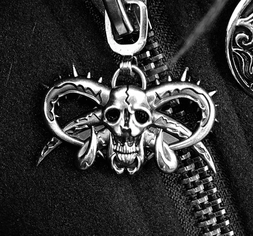 Hood construction detail of gothic punk coat with fur trim and adjustable straps