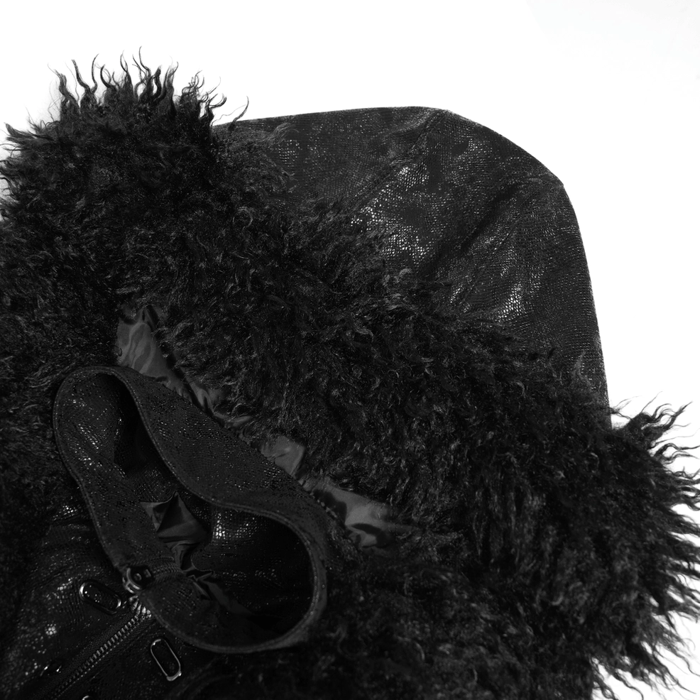 Gothic trench coat showing layered waist strap architecture and cracked faux leather texture under dramatic lighting