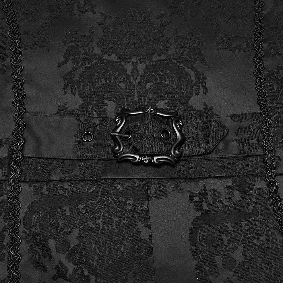 Close-up of ornate metal belt buckle on black jacquard gothic tailcoat