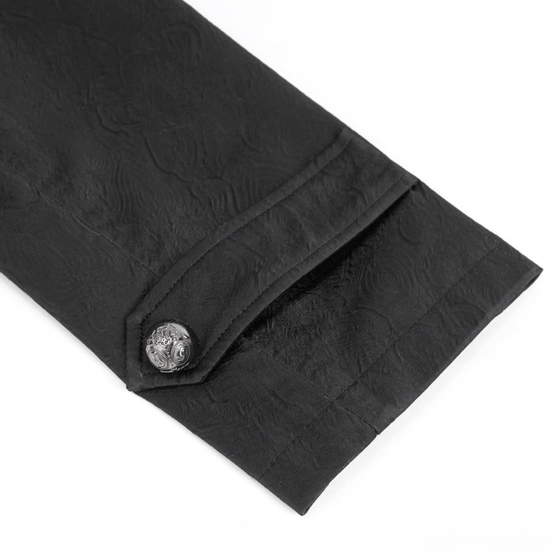 Close-up detail of ornate metal cuff button on black leather gothic coat sleeve