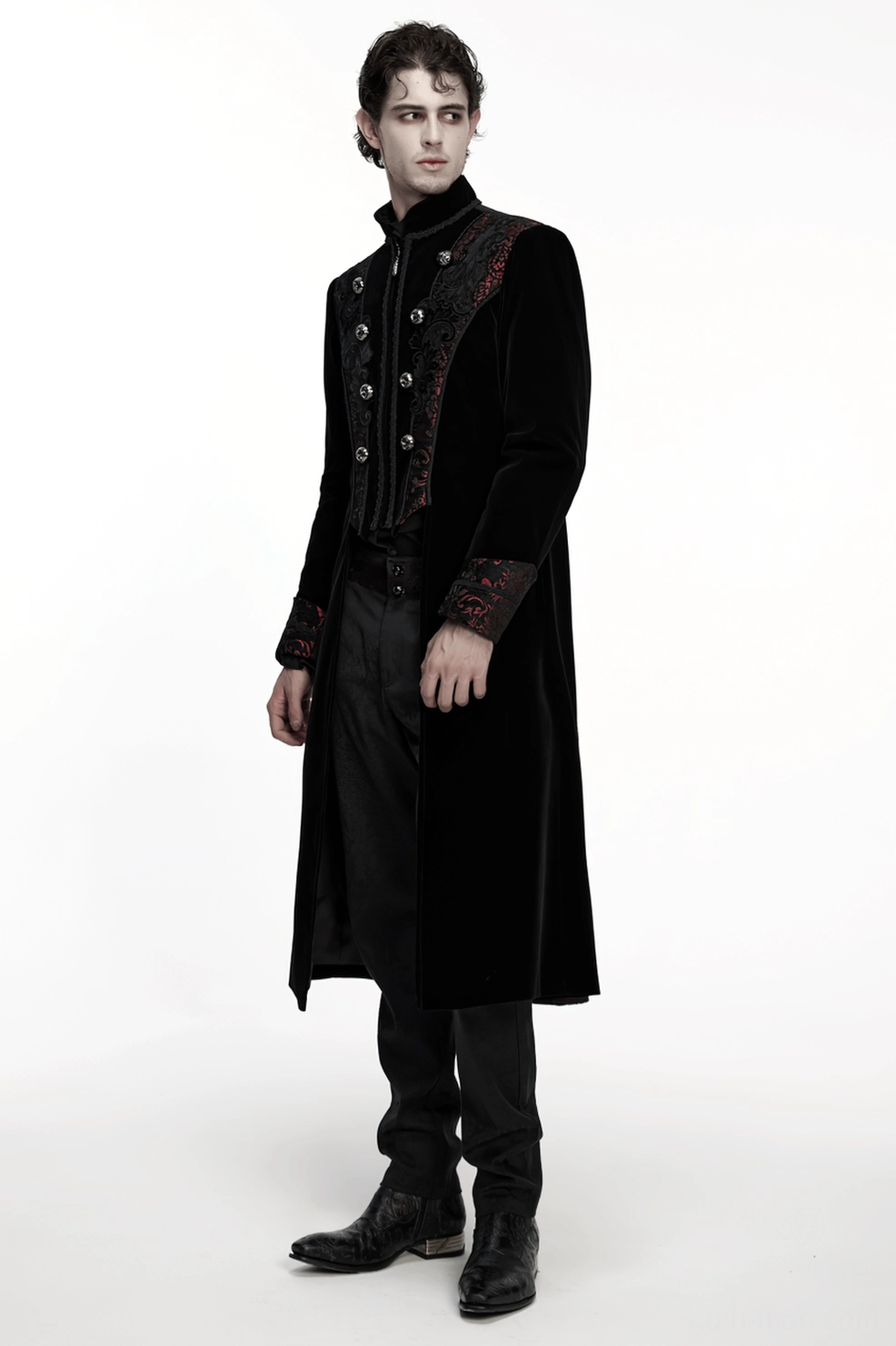 Overhead styled view of gothic velvet coat showing embroidered detailing and fabric texture