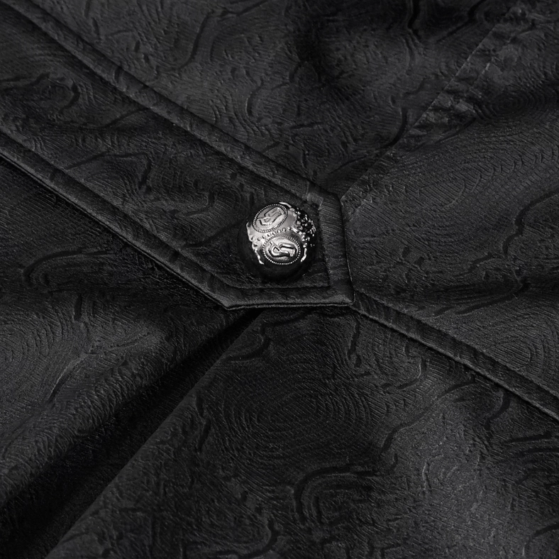 Close-up of precision stitch seam and ornate metal decorative button on gothic coat