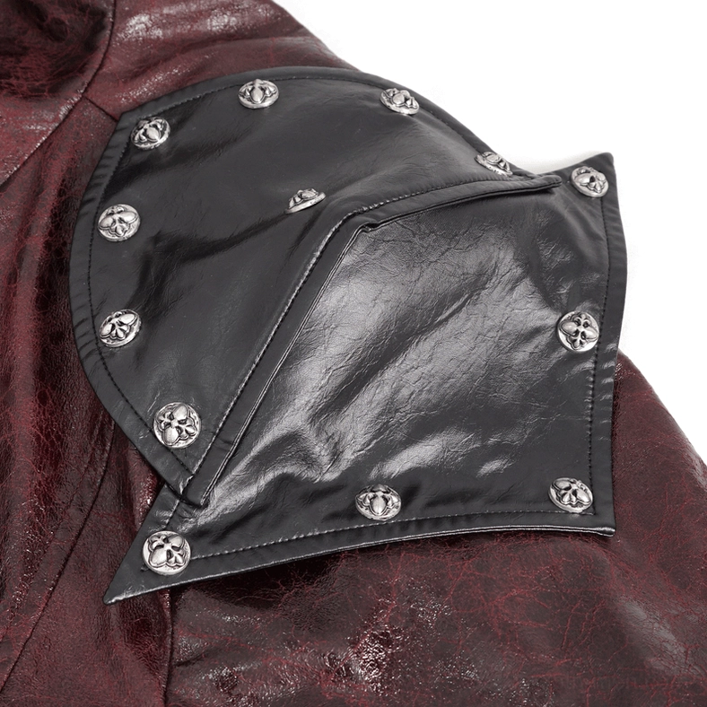 Close-up of shoulder armor plating with round metal studs on black leather from gothic coat