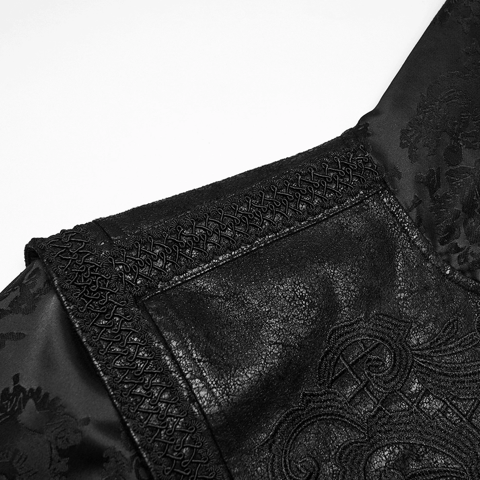 Close-up detail of gothic coat shoulder showing braided trim and embroidered jacquard fabric texture