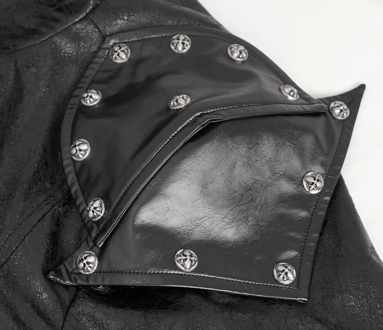 Close-up of gothic coat shoulder pad featuring cross-pattern metal rivets embedded in black faux leather shoulder piece detail