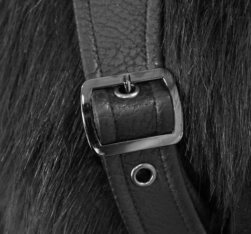 Side zipper pocket detail on black gothic punk coat showing functional design