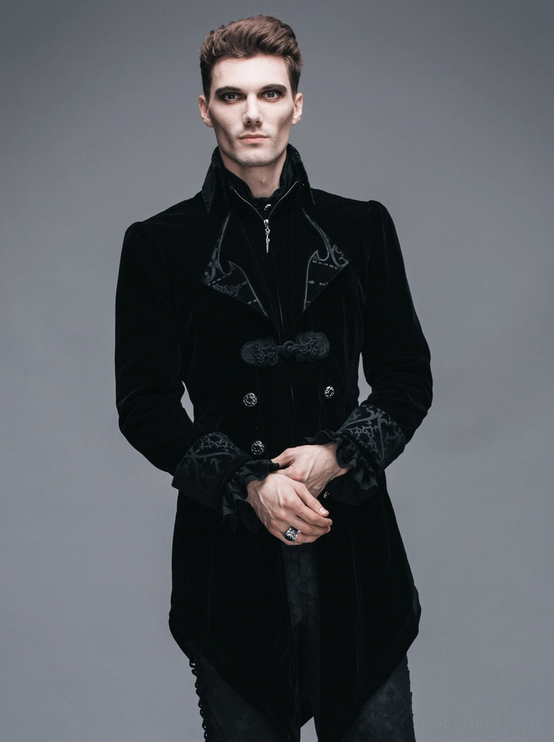 Gothic black velvet coat paired with alternative styling accessories and silver chain details