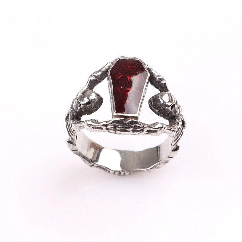 Gothic coffin skeleton ring top-front view - double skeleton accents with polished silver band and vivid red stone center