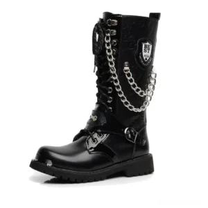 Black gothic mid-calf combat boots with metal chains and rivet details, side profile view showcasing handmade construction and industrial aesthetic