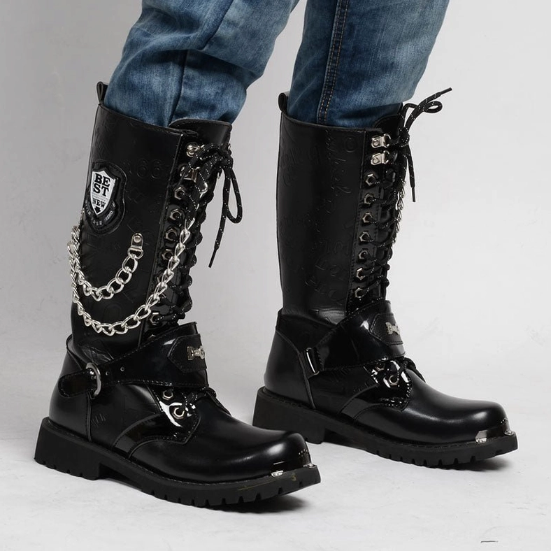 Front three-quarter view of gothic combat boots on model wearing blue denim, showcasing thick platform lug sole and tactical straps