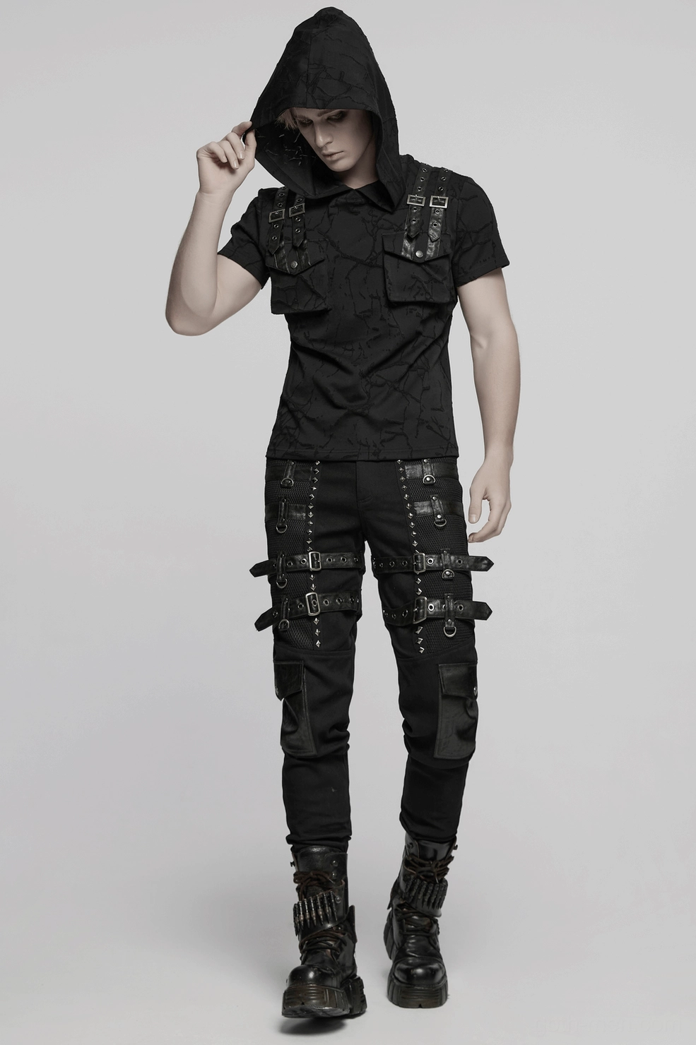Gothic combat pants mid-section showing adjustable thigh strap system with pyramid studs and D-ring attachment