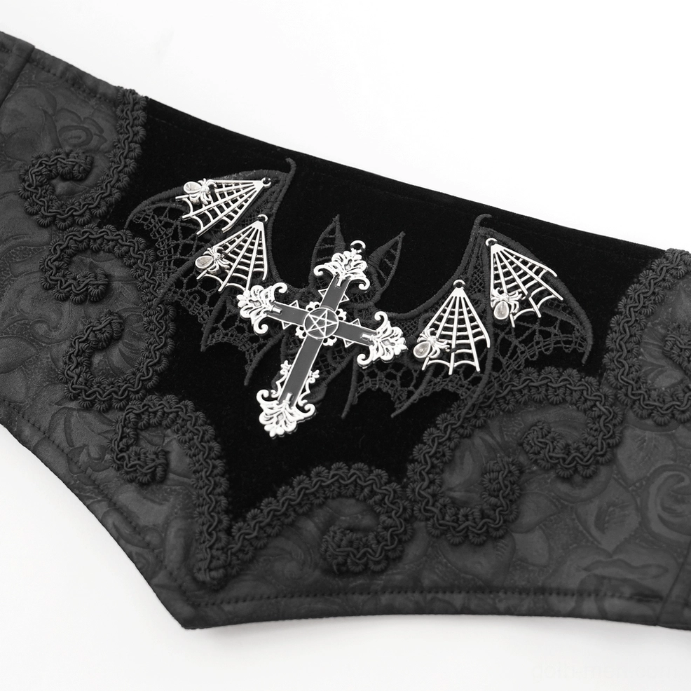 Extreme close-up of gothic corset belt embroidery - silver-tone cross, bat and spiderweb motifs detail