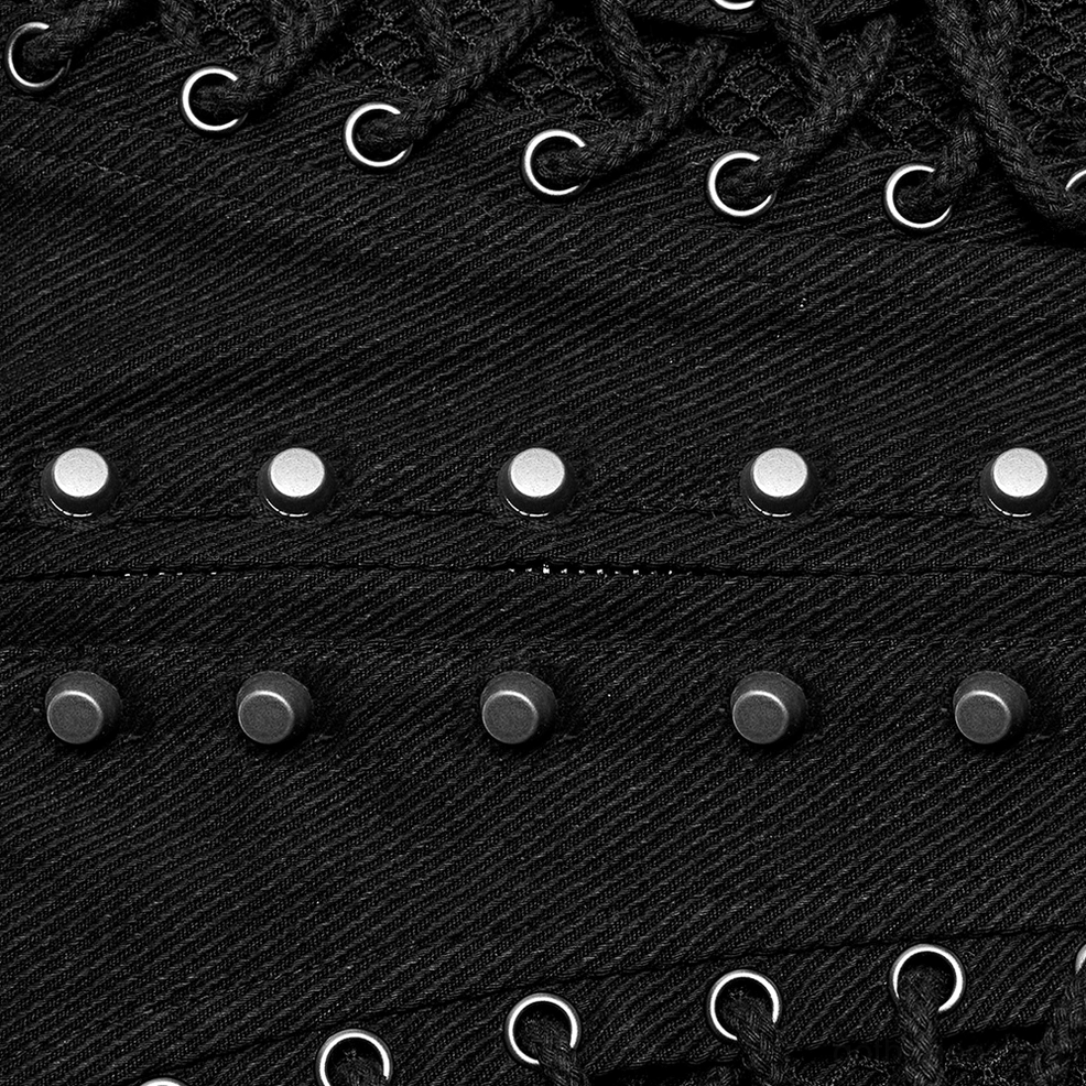 Macro close-up of metal studs and silver hardware on gothic lace-up corset belt