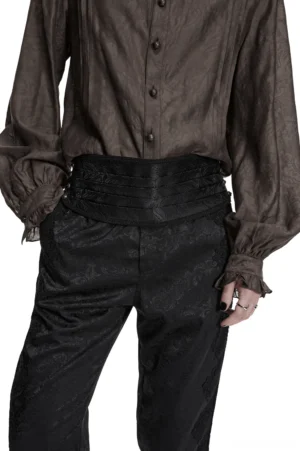 Black jacquard pleated gothic corset belt worn by male model in studio setting, front full-body view showcasing dimensional pleat design and waist definition