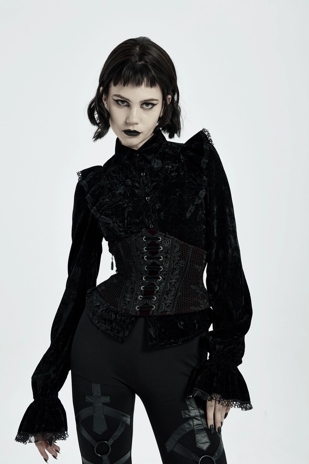 Burgundy velvet gothic corset belt texture and velvet pile quality close-up with lace accents