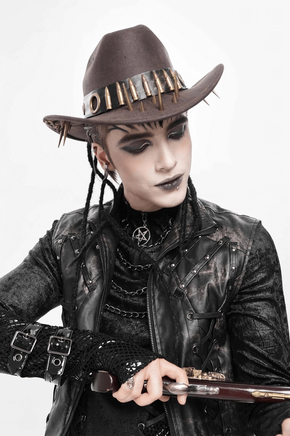 Brown gothic cowboy hat angled view displaying complete metal bullet and spike embellishment layout on dark leather material