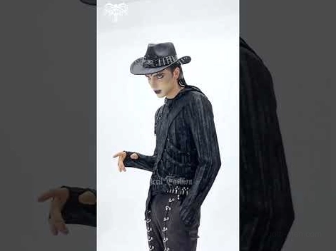 Full length gothic fashion outfit featuring black skull and bullet decorated cowboy hat paired with all-black goth clothing ensemble