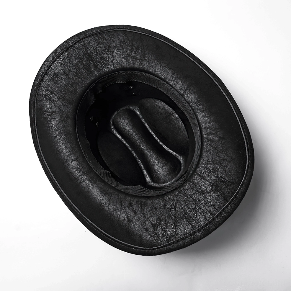 Interior lining of black cowboy hat showing padded crown and suede material