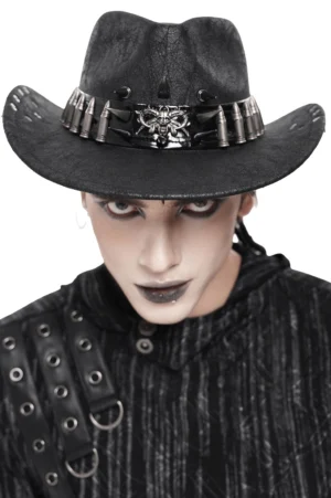 Black gothic cowboy hat with metal spike and bullet stud trim worn by male model with dark makeup, front view