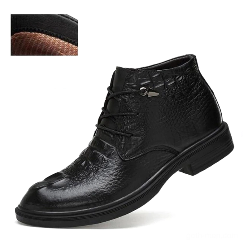 Black leather gothic boot with embossed crocodile grain pattern, low block heel visible from side angle
