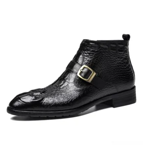 Gothic crocodile embossed leather ankle boots with metal buckle strap, left side profile view in black