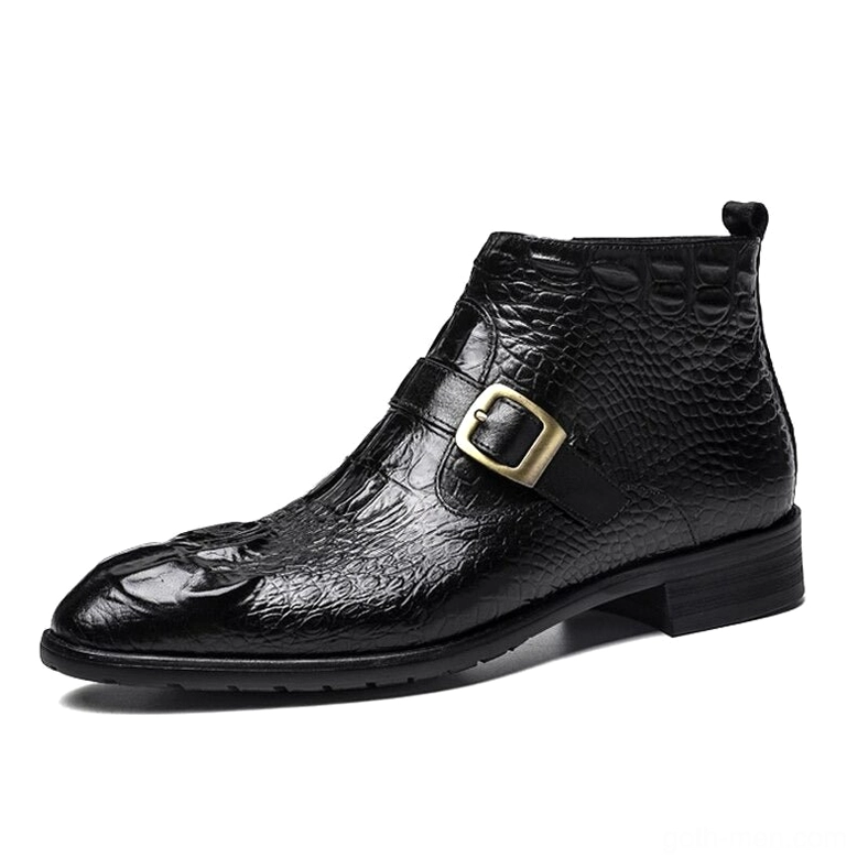 Gothic crocodile embossed leather ankle boots with metal buckle strap, left side profile view in black