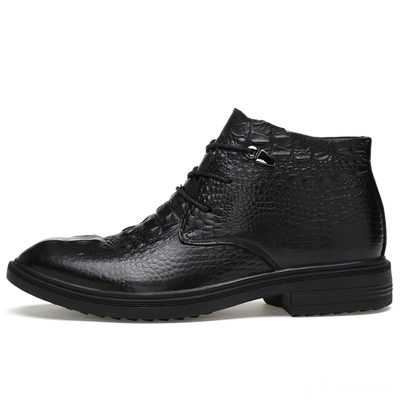 Black gothic leather ankle boot with embossed crocodile grain texture, side view emphasizing textural detail