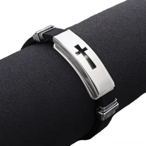 Style 1 gothic cross bracelet close-up showing sleek metal plaque design and secure locking clasp on display stand