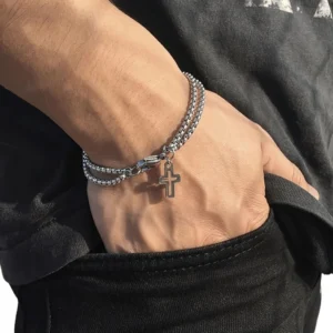 Double chain cross bracelet worn on male wrist - titanium steel gothic style jewelry