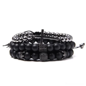 Black matte stone multi-layer gothic cross charm bracelet set with gunmetal cross ornament, flat lay view
