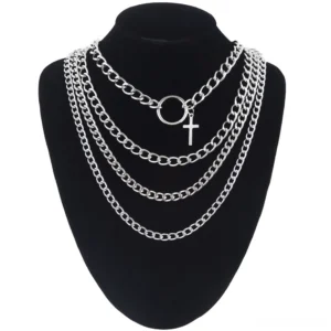 Multi-layer gothic cross choker necklace set displayed on black mannequin, front view showing four silver chains with cross pendant and o-ring charm