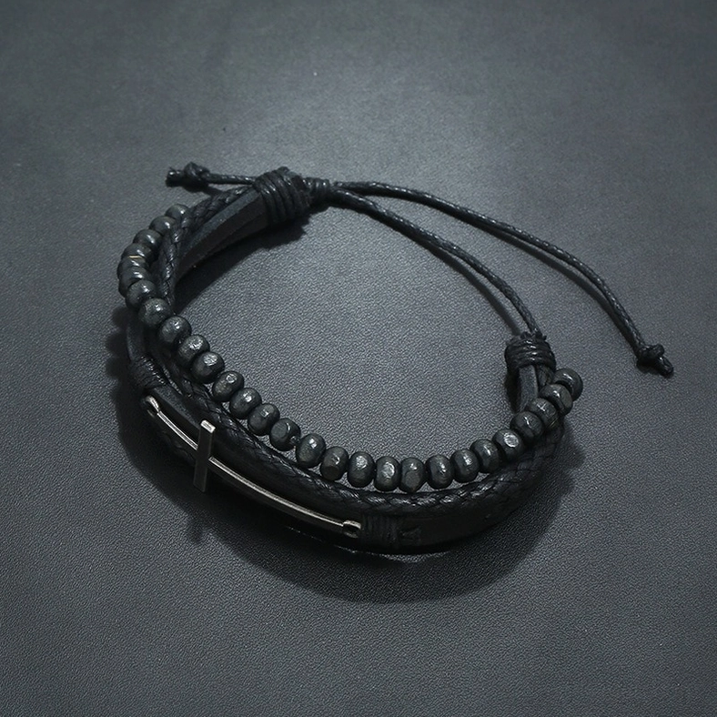 Adjustable gothic cross leather bracelet with wax cord lacing - top-down view showing braided construction