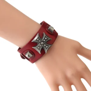 Red gothic cross leather wrap bracelet worn on mannequin wrist, side view showcasing metal cross detail and adjustable cuff design