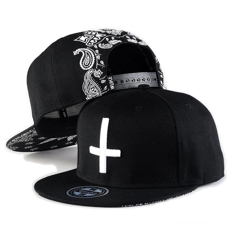 Black gothic cross embroidery snapback baseball cap front and side view with white cross detail and paisley pattern