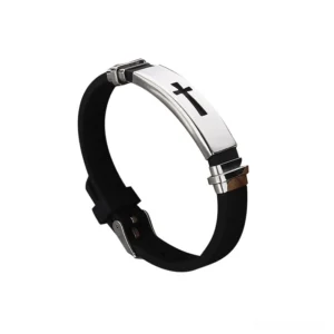 Gothic cross titanium steel silicone bracelet with polished silver metal plate and black adjustable strap, three-quarter side view