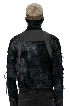Rear view of post-apocalyptic crossbody chest bag on male model showing back harness design and side pouch attachment