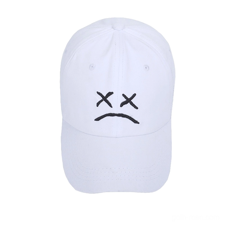 White alternative fashion baseball cap with crying face embroidery, front flat lay detail