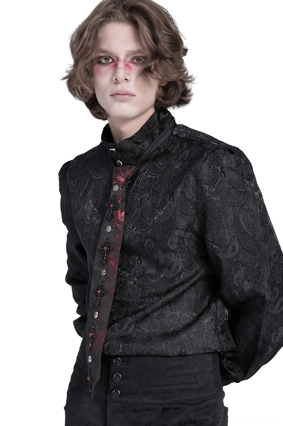 Gothic necktie styled with black jacquard dress shirt on male model with gothic makeup, side full-body view