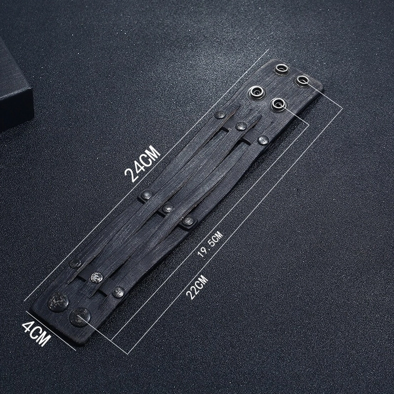 Flat lay unfolded black leather gothic cuff bracelet showing full length adjustable holes and snap fastener positions with measurement reference