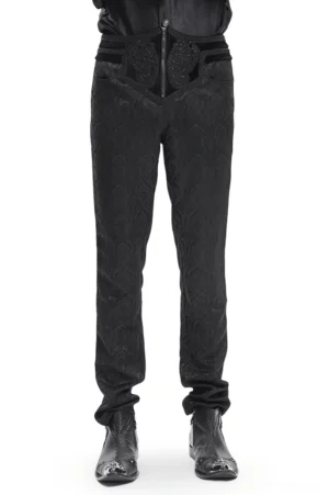 Black Gothic damask embossed slim-fit pants front view, male model wearing black high-waist pants with intricate damask pattern on white studio background