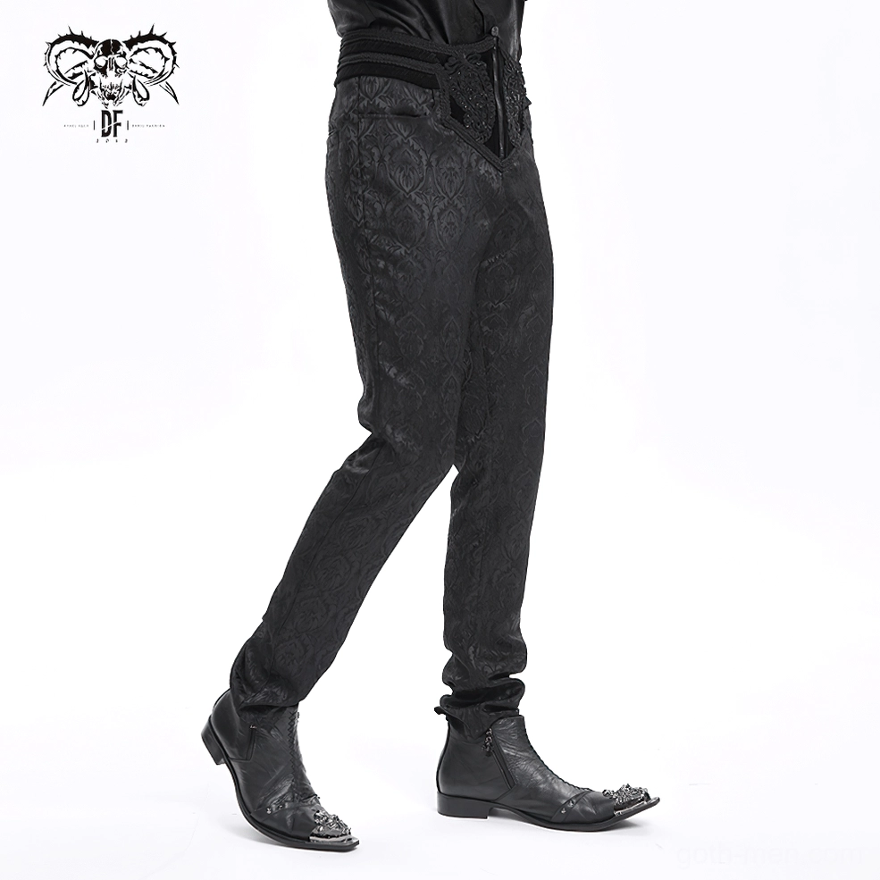 Gothic damask pants full-length back view, male model in studio showing rear silhouette, slim leg cut, and overall damask embossed design