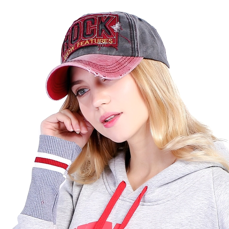 Distressed gothic denim baseball cap worn on female model three-quarter side angle maroon and gray two-tone design